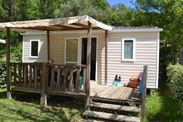 Mobile home with wooden terrace at Camping de l'Ardèche Vallon Pont d'Arc